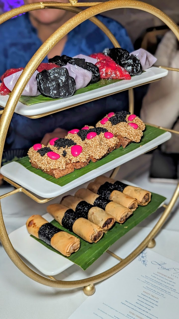 Tiered Luna Lu dumplings, prawn toast, and spring rolls